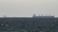 Strait of Hormuz closed again, Iran says, as ships attacked