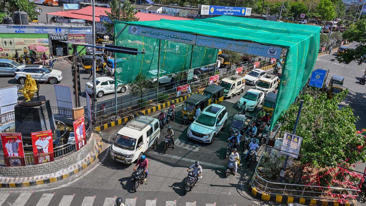Summer relief for commuters, GVMC sets up green shade at RTC Complex junction