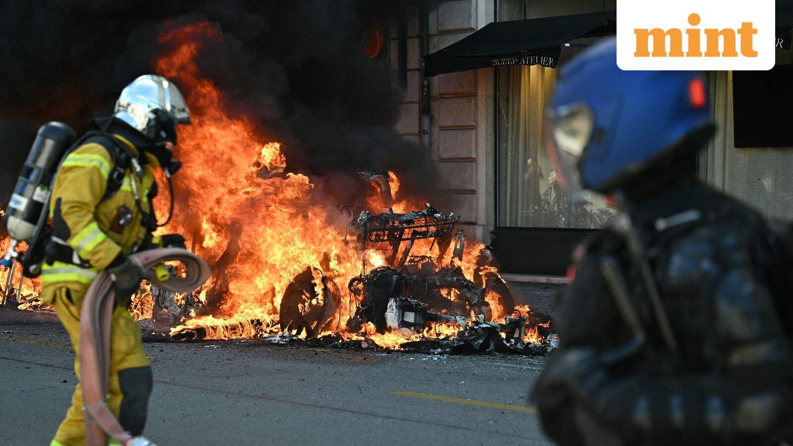 Tesla set ablaze, bank windows smashed in Geneva as demonstrators gathered to protest G7 summit in France